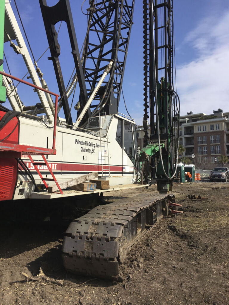 Palmetto piling machine on construction site