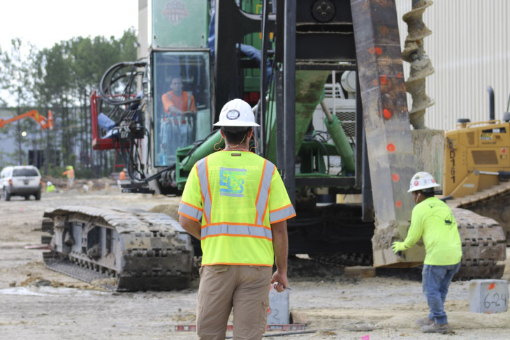 Installing piles on construction site