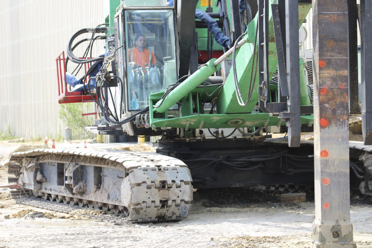 Installing piles on construction site