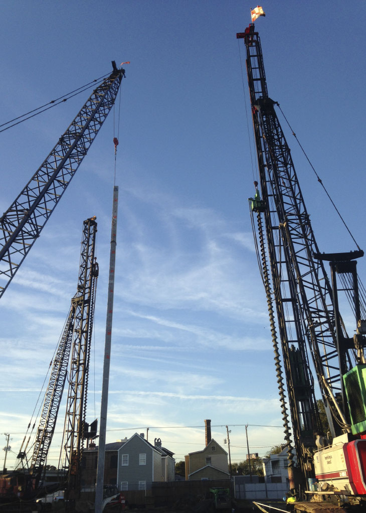 Two pile drivers on construction site